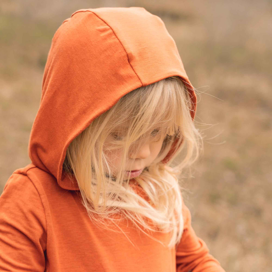 The Toddler Chaser sun hoodie protects your toddler and child from the sun while outdoors.