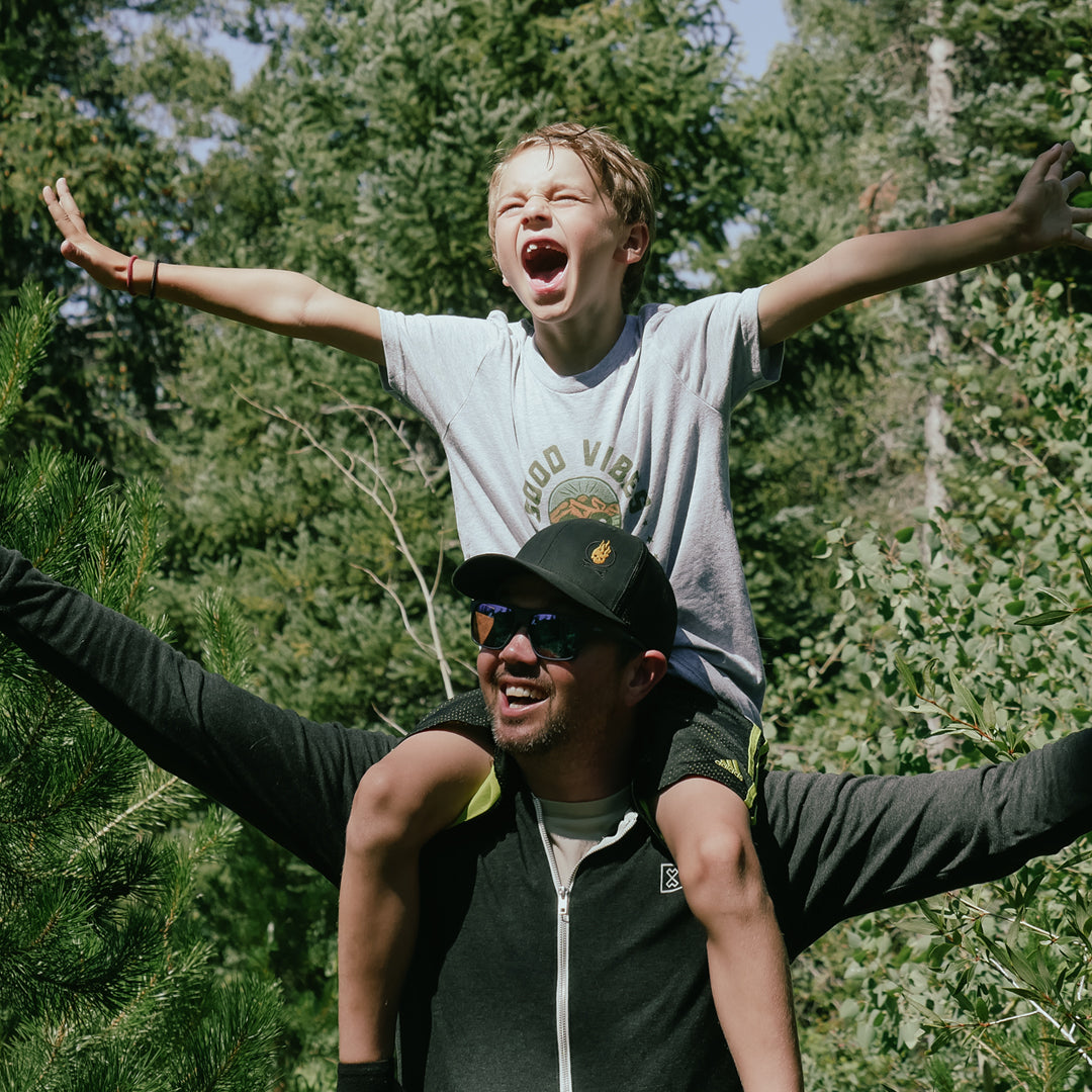 Milk x whiskey a dad and his son adventuring with our adventure hoodies tumbler gear in nature and the forest
