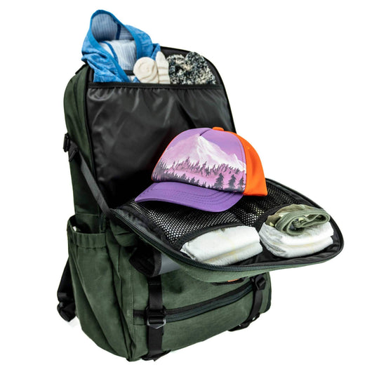  lot of baby clothing and toy storage in the baby compartment of the Adventure Proof Dad Diaper Backpack