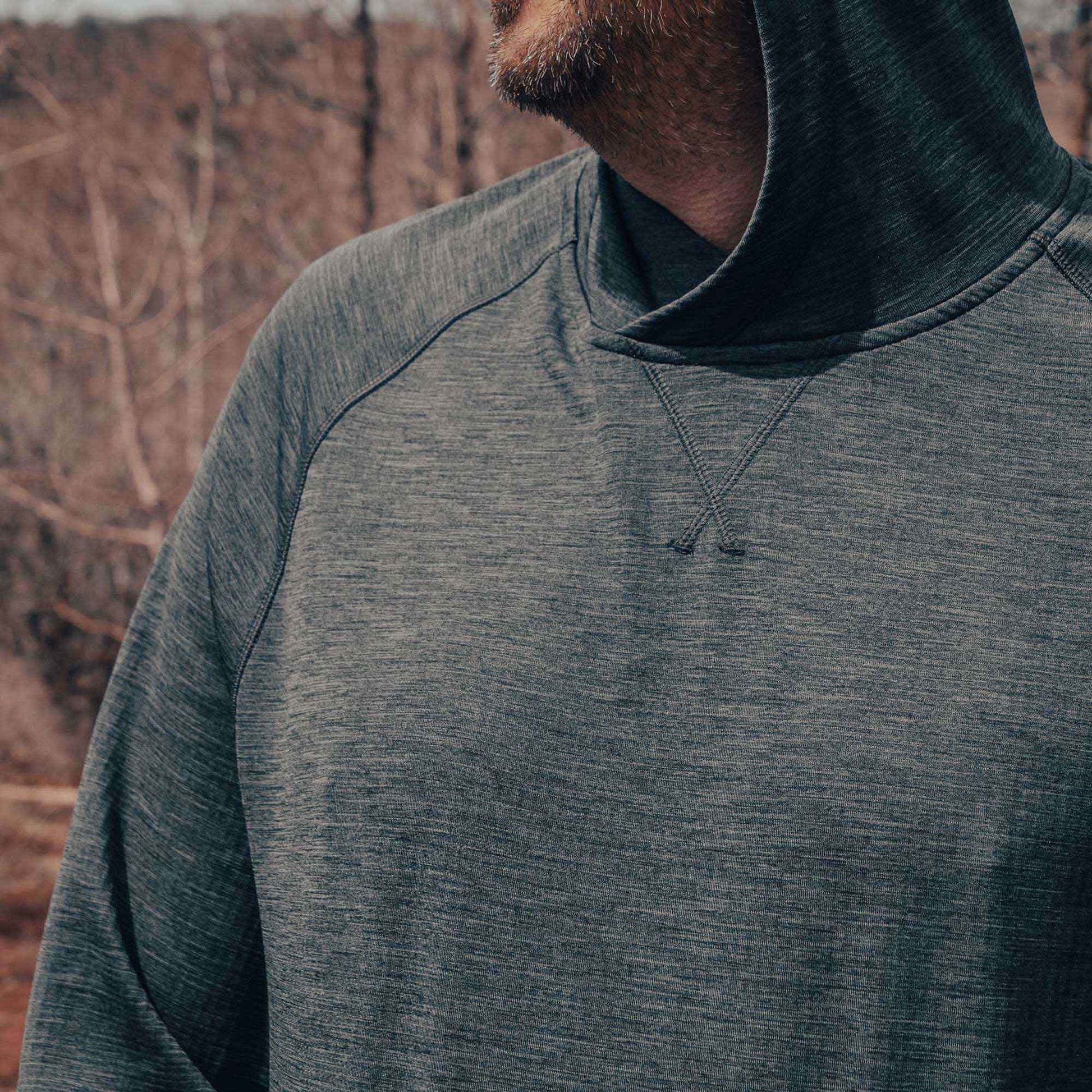Unisex Tumbler Grid Fleece Hoodie for outdoor activities, showcasing mid-weight material for warmth and comfort in nature.