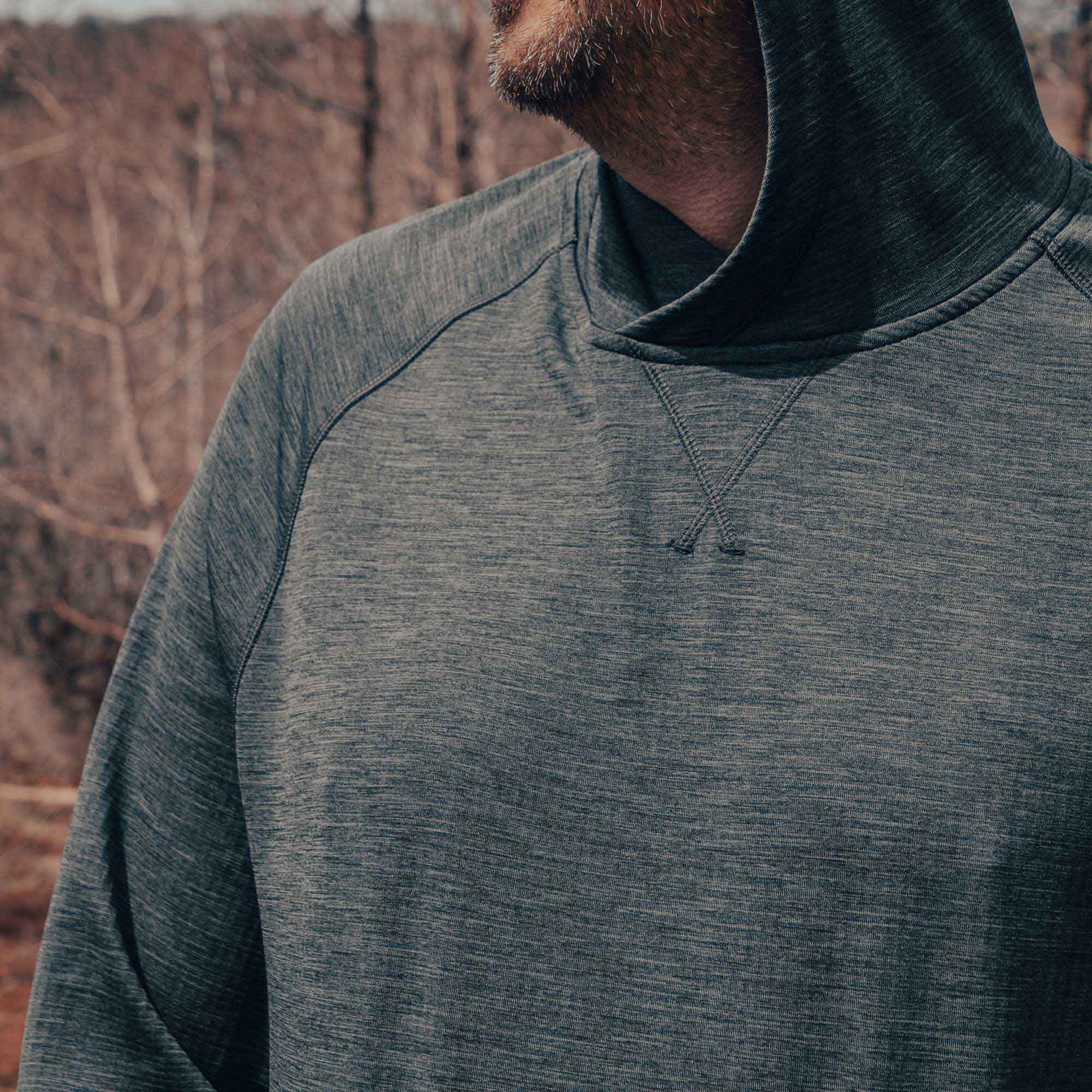 Unisex Tumbler Grid Fleece Hoodie for outdoor activities, showcasing mid-weight material for warmth and comfort in nature.
